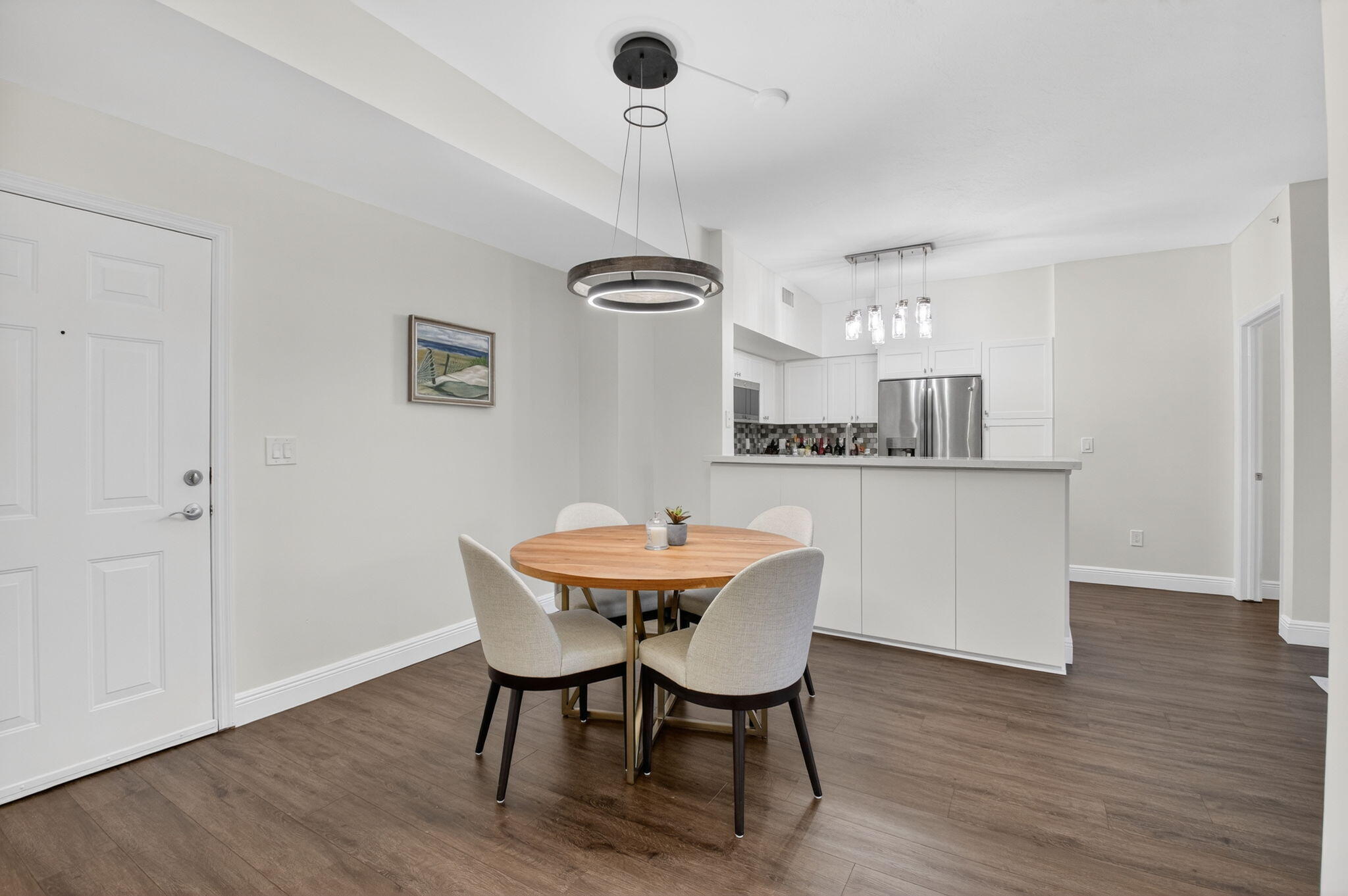 233 South Federal Highway, Unit 423 Boca Raton, FL 33432 - Photo 11 of 55 a view of a dining room with furniture window and wooden floor