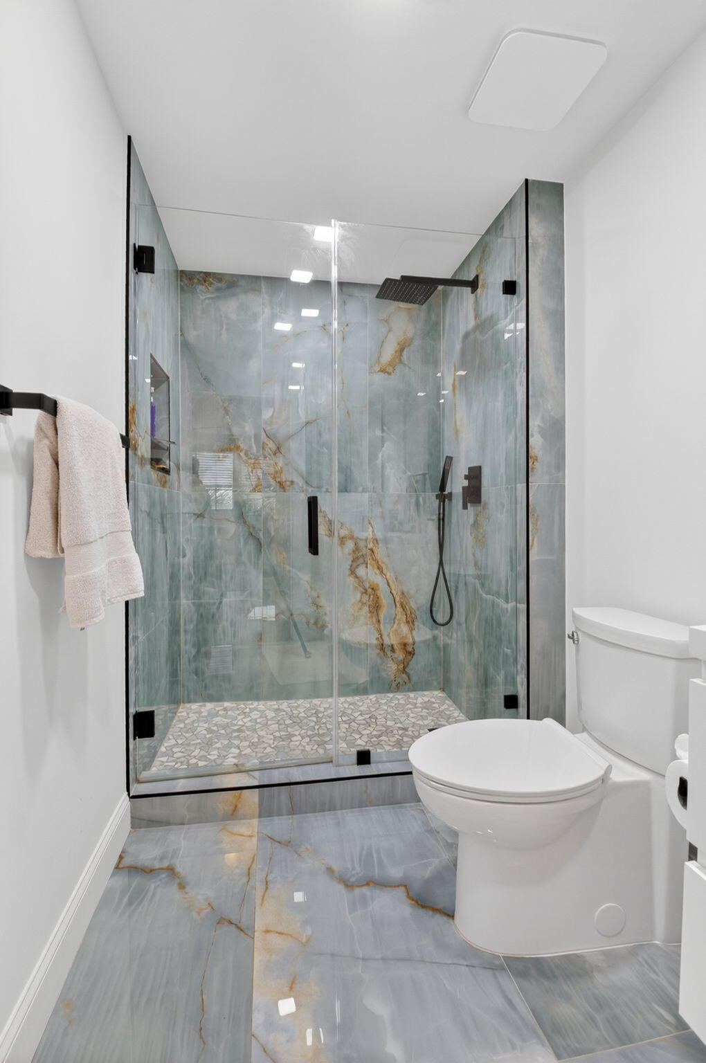 233 South Federal Highway, Unit 423 Boca Raton, FL 33432 - Photo 15 of 55 a bathroom with a granite countertop toilet a shower and a sink