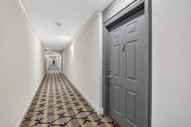 a view of a swimming pool with outdoor seating