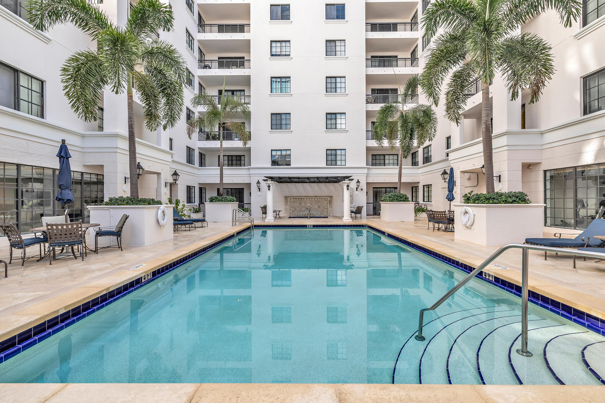 233 South Federal Highway, Unit 423 Boca Raton, FL 33432 - Photo 25 of 55 a view of a swimming pool with outdoor seating