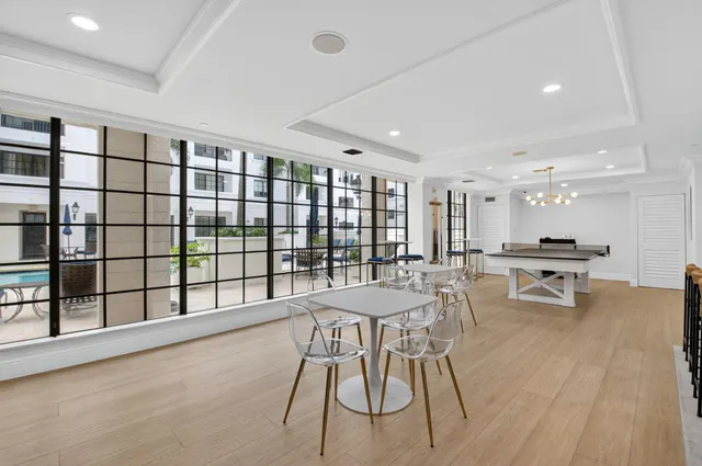 a view of a dining room with furniture wooden floor and flat screen tv