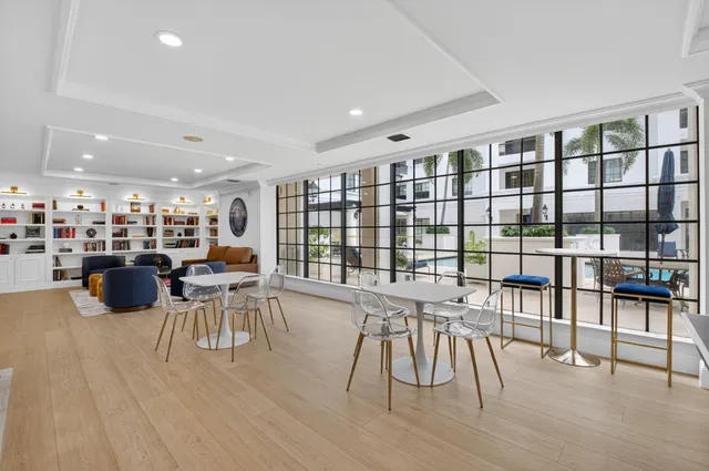 a room with gym equipment and large mirror