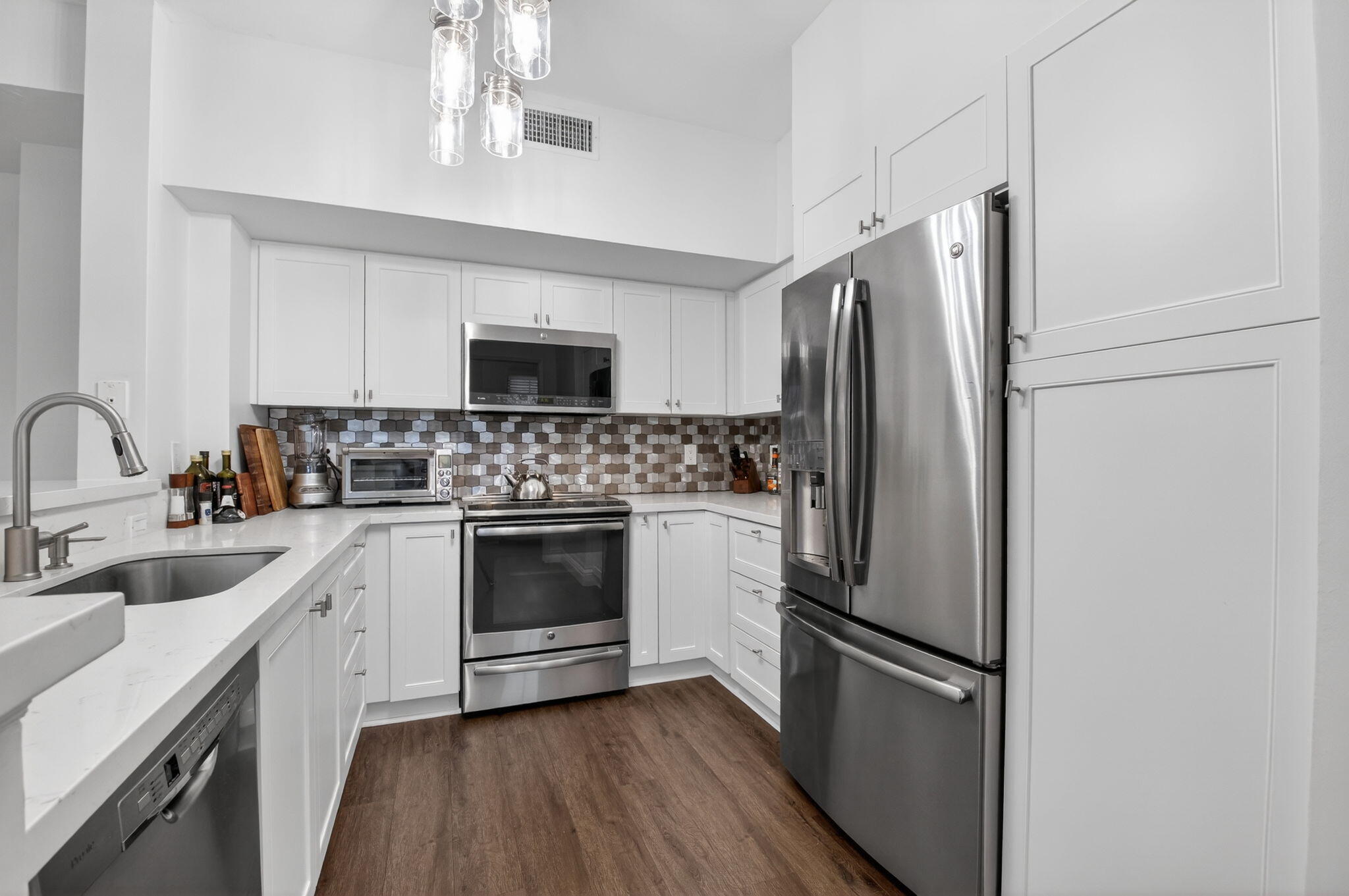 233 South Federal Highway, Unit 423 Boca Raton, FL 33432 - Photo 9 of 55 a kitchen with a refrigerator stove and sink