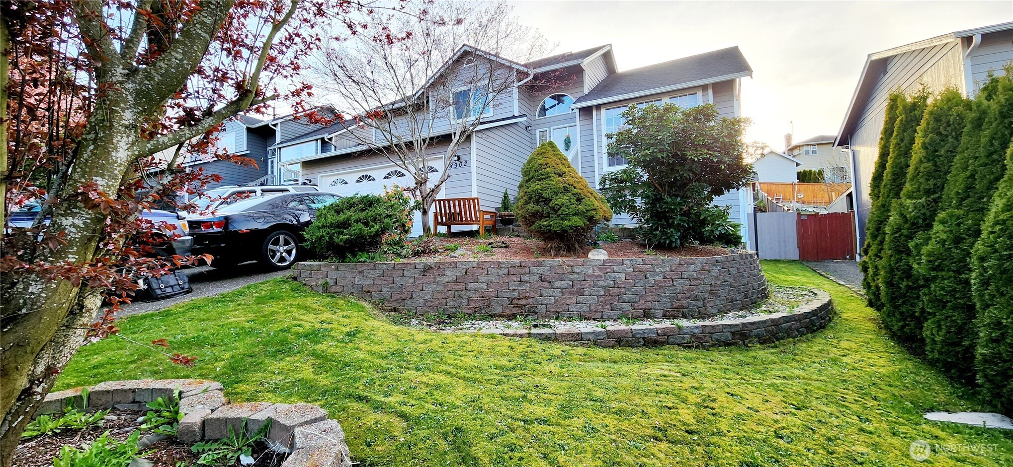 a view of a house with a yard and plants