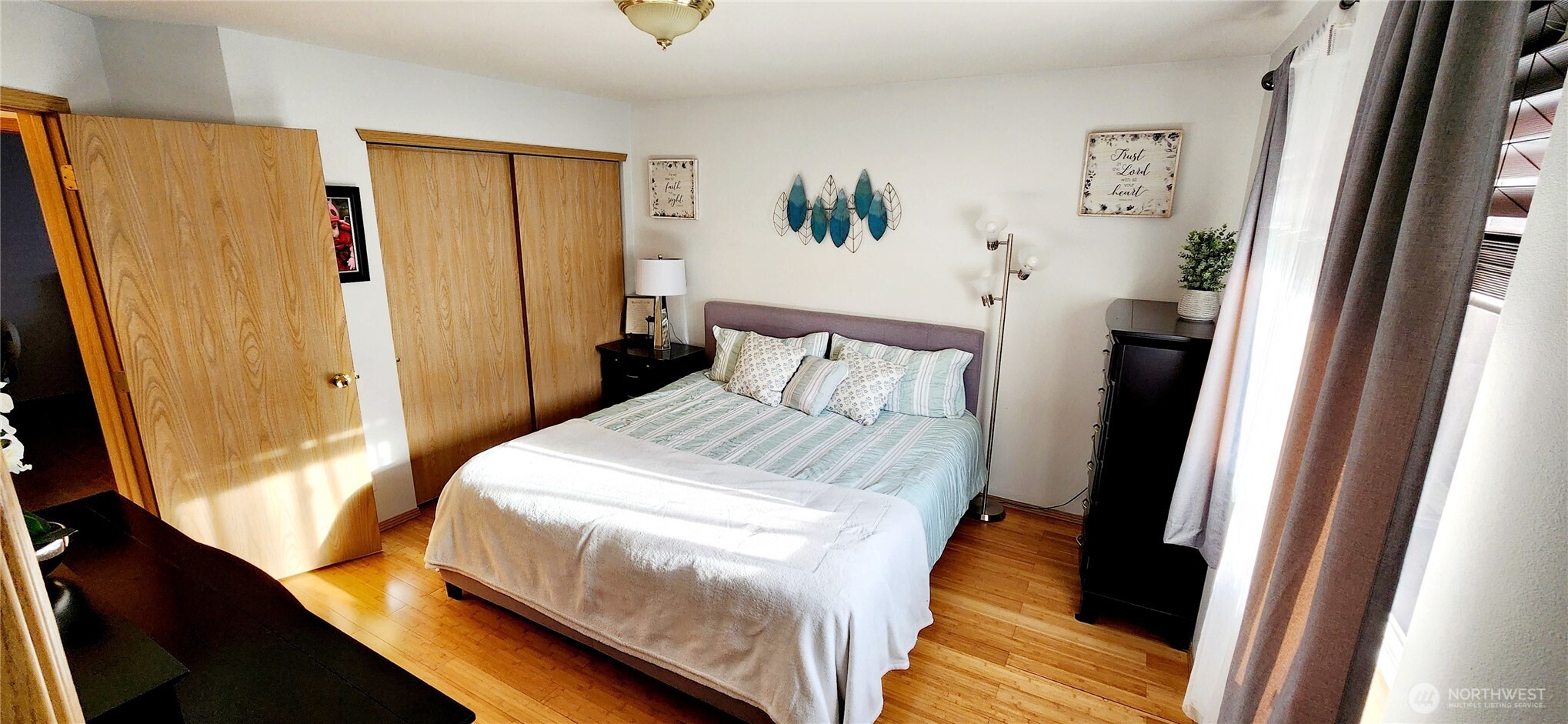 8902 West Mall Drive Everett, WA 98208 - Photo 11 of 23 a bedroom with a bed and a window