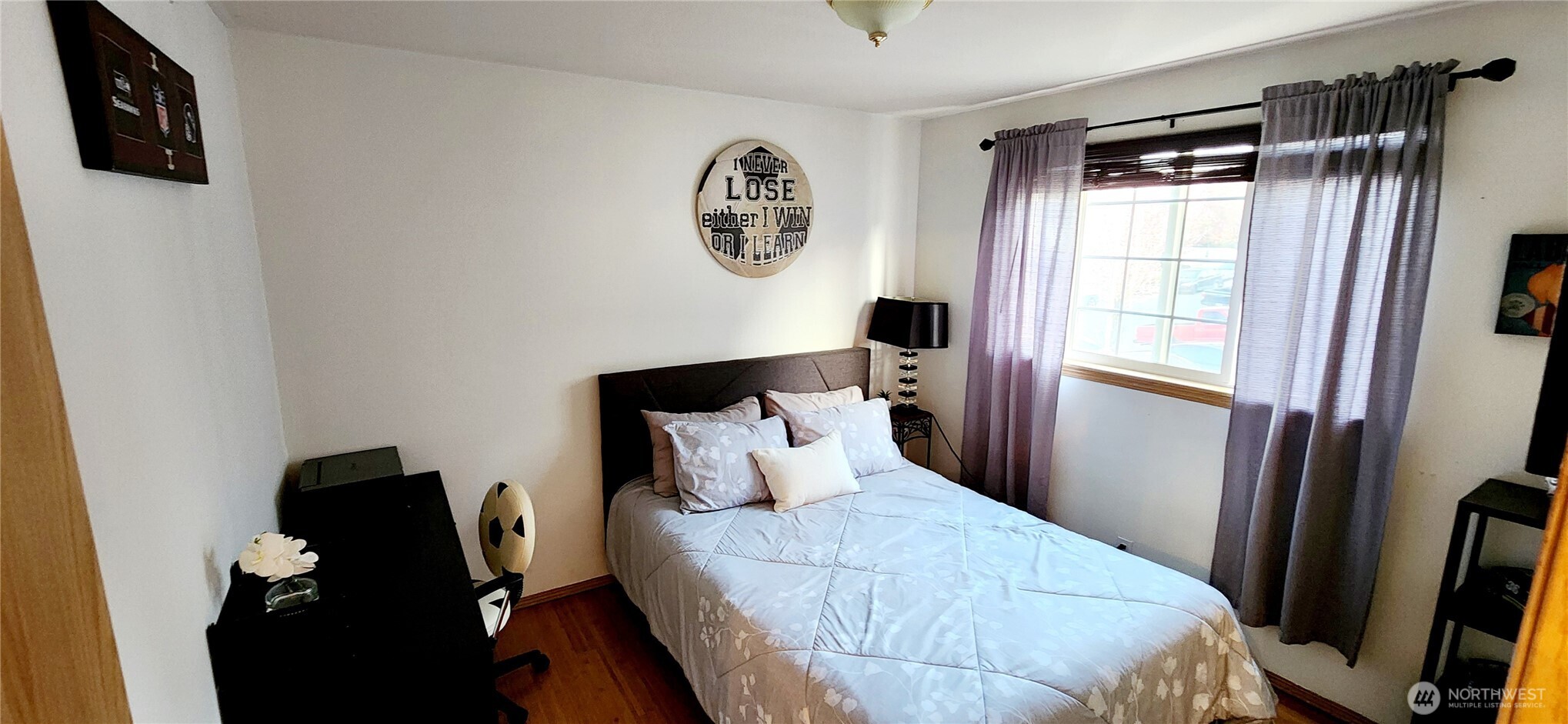 8902 West Mall Drive Everett, WA 98208 - Photo 12 of 23 a bedroom with a bed and a flat tv screen