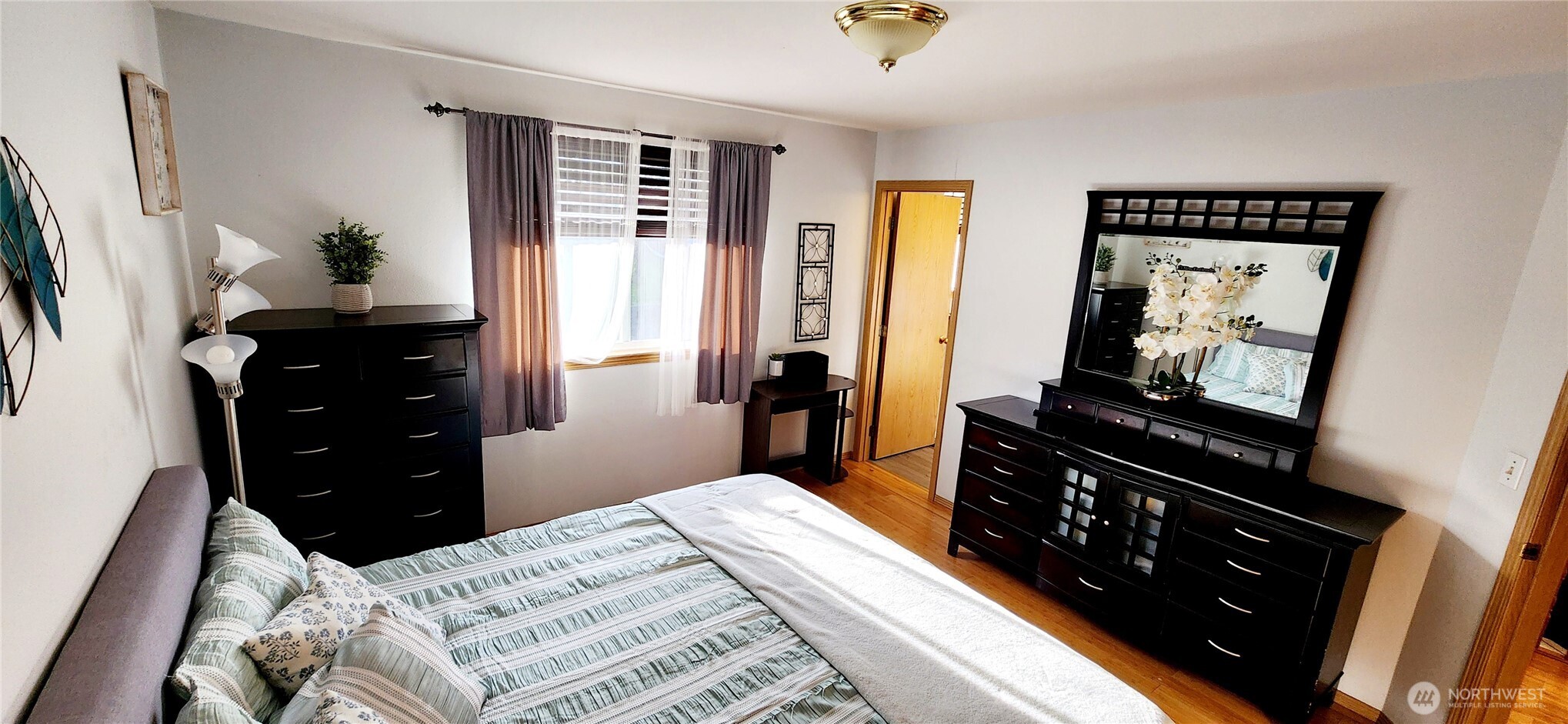 8902 West Mall Drive Everett, WA 98208 - Photo 14 of 23 a bedroom with a bed and a dresser in it