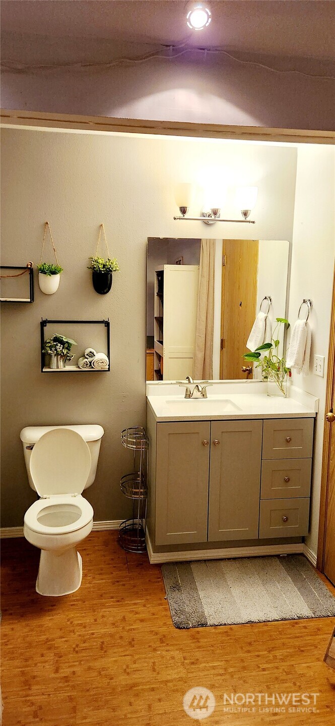 8902 West Mall Drive Everett, WA 98208 - Photo 17 of 23 a bathroom with a toilet sink and mirror