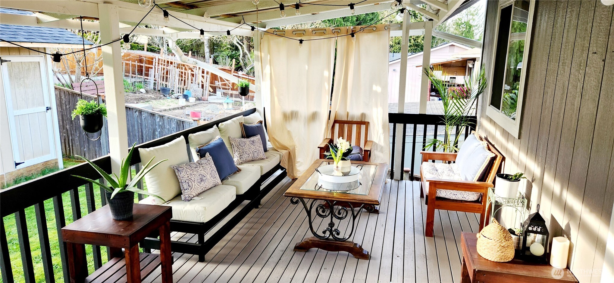 8902 West Mall Drive Everett, WA 98208 - Photo 19 of 23 a balcony with wooden floor outdoor seating and furniture