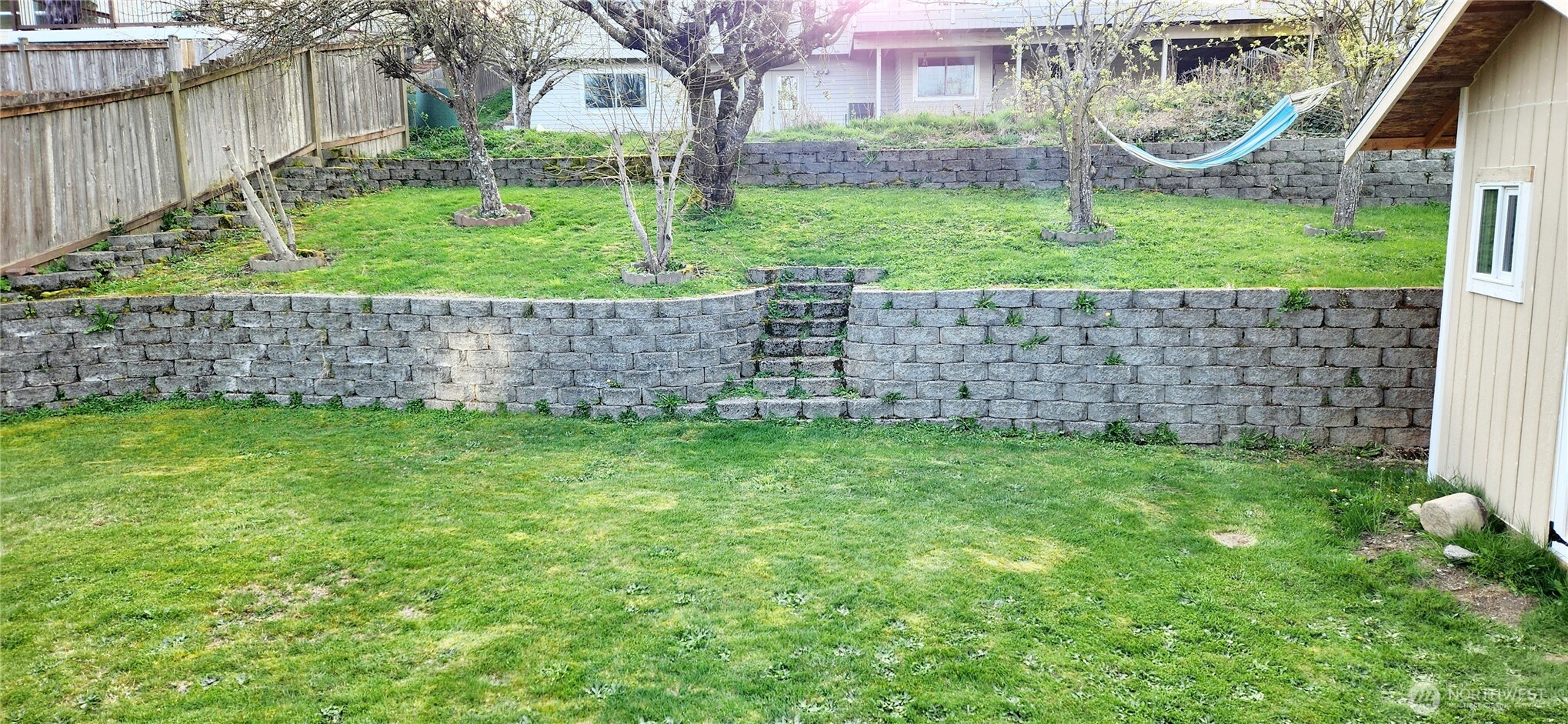 8902 West Mall Drive Everett, WA 98208 - Photo 21 of 23 a view of a garden with a small house