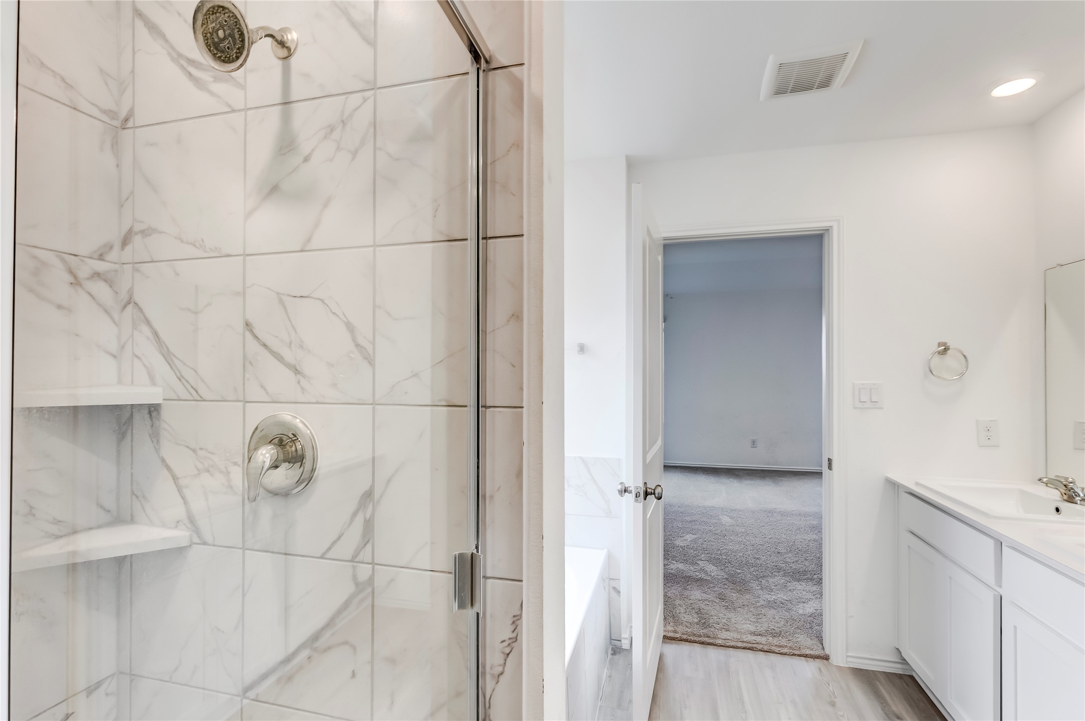 591 Avre Loop Kyle, TX 78640 - Photo 23 of 34 a bathroom with a shower