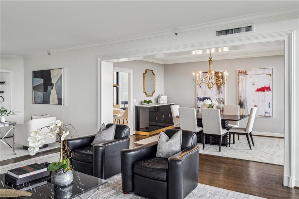 2660 Peachtree Road Northwest, Unit 23A Atlanta, GA 30305 - Photo 11 of 56 a living room with furniture kitchen view and a wooden floor