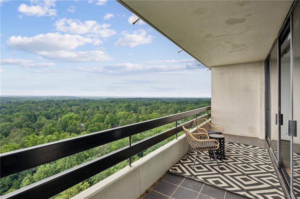 2660 Peachtree Road Northwest, Unit 23A Atlanta, GA 30305 - Photo 13 of 56 a view of balcony with wooden floor