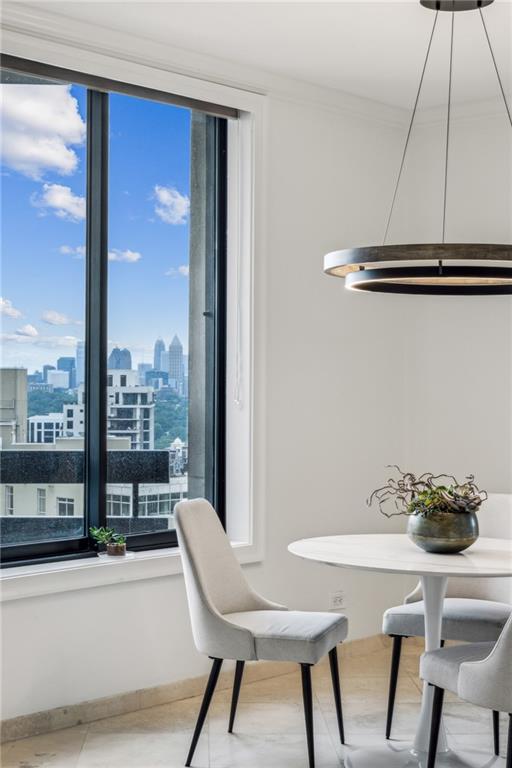 2660 Peachtree Road Northwest, Unit 23A Atlanta, GA 30305 - Photo 22 of 56 a view of a dining room with furniture window and outside view