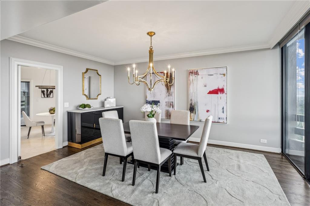 2660 Peachtree Road Northwest, Unit 23A Atlanta, GA 30305 - Photo 24 of 56 a dining room with furniture and window