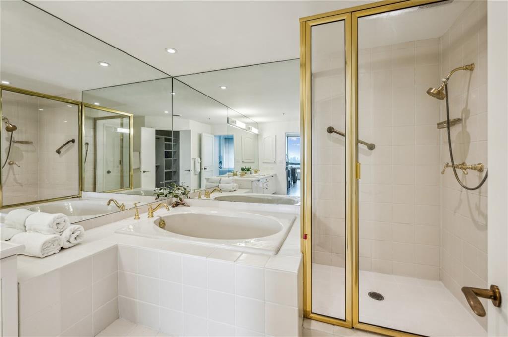 2660 Peachtree Road Northwest, Unit 23A Atlanta, GA 30305 - Photo 31 of 56 a bathroom with a sink and a mirror