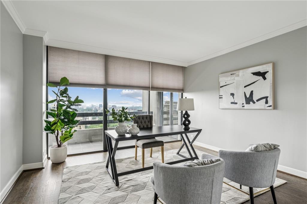 2660 Peachtree Road Northwest, Unit 23A Atlanta, GA 30305 - Photo 37 of 56 a living room with furniture and a potted plant