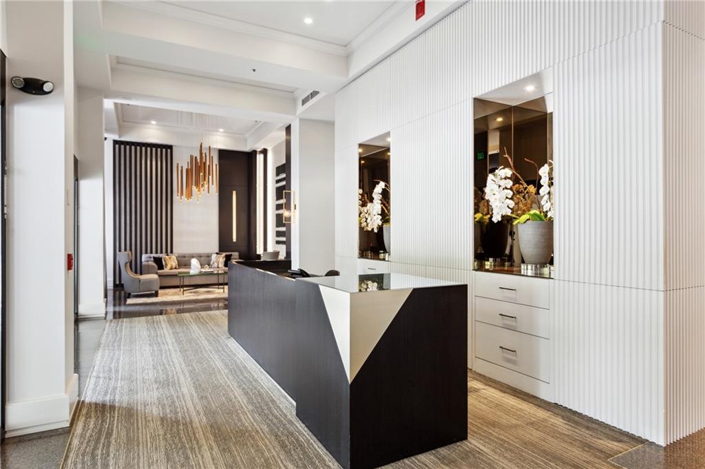 2660 Peachtree Road Northwest, Unit 23A Atlanta, GA 30305 - Photo 40 of 56 a living room with stainless steel appliances furniture and a large window