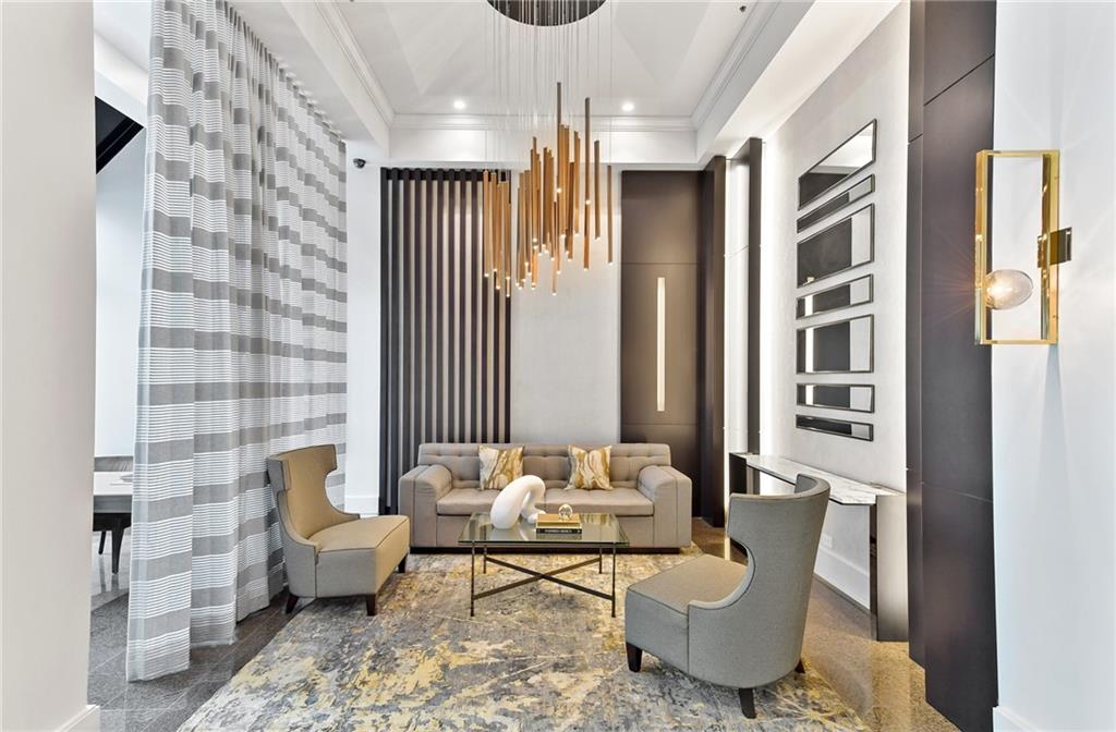 2660 Peachtree Road Northwest, Unit 23A Atlanta, GA 30305 - Photo 41 of 56 a living room with furniture and a window