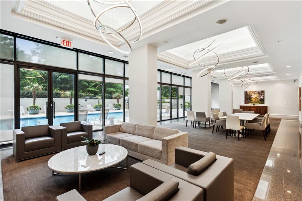 2660 Peachtree Road Northwest, Unit 23A Atlanta, GA 30305 - Photo 42 of 56 a living room with furniture and a large window