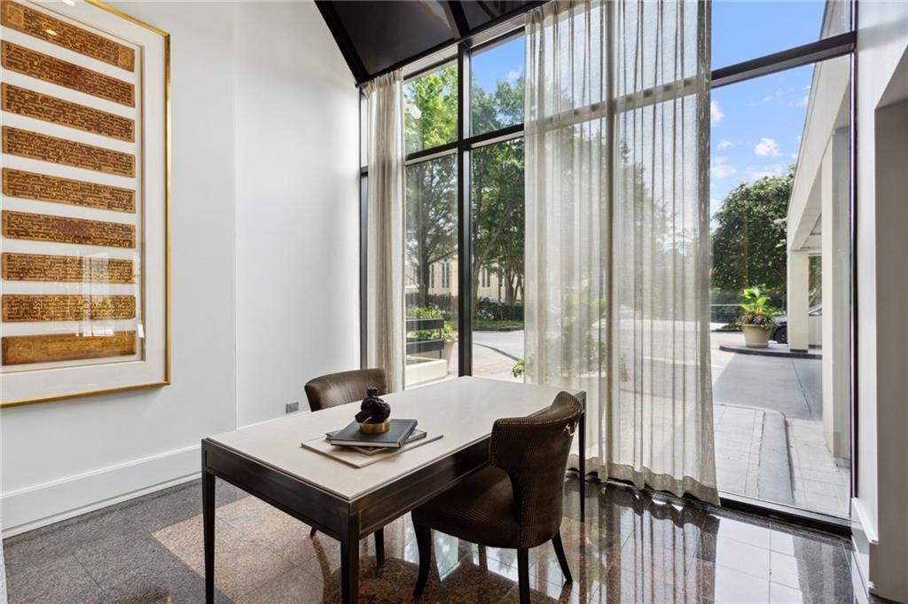 2660 Peachtree Road Northwest, Unit 23A Atlanta, GA 30305 - Photo 44 of 56 a view of a workspace with a table and chair in a room