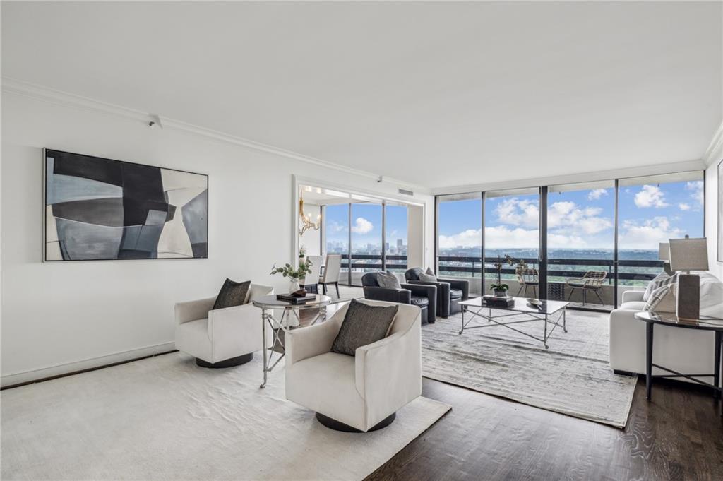 2660 Peachtree Road Northwest, Unit 23A Atlanta, GA 30305 - Photo 8 of 56 a living room with furniture and floor to ceiling window