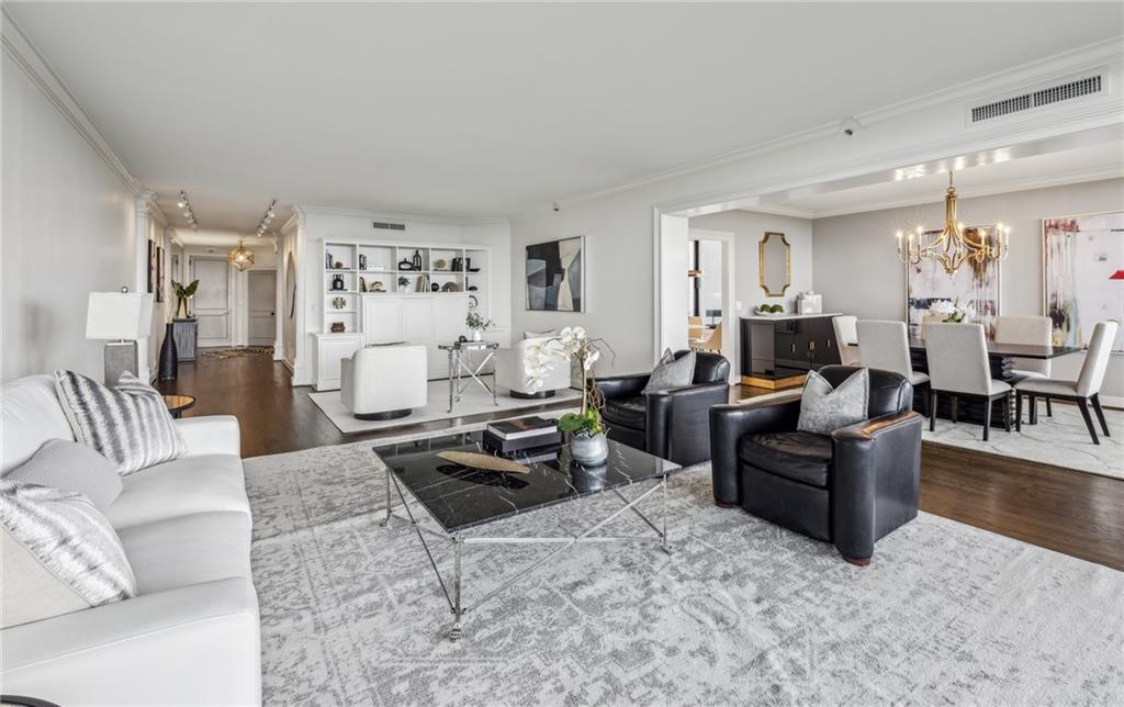 2660 Peachtree Road Northwest, Unit 23A Atlanta, GA 30305 - Photo 9 of 56 a living room with furniture and wooden floor