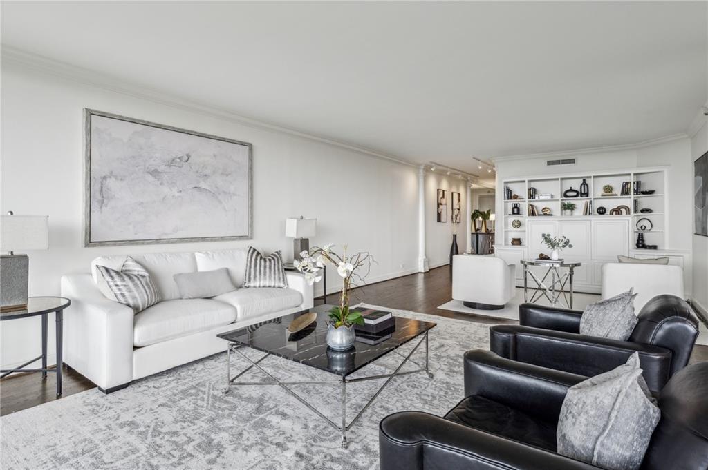 2660 Peachtree Road Northwest, Unit 23A Atlanta, GA 30305 - Photo 10 of 56 a living room with furniture and wooden floor