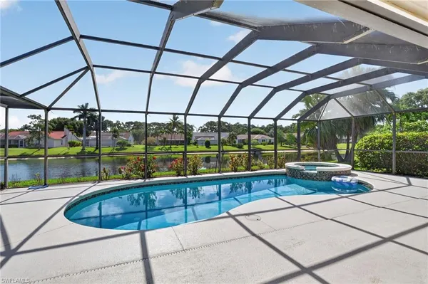 a view of a swimming pool with a porch