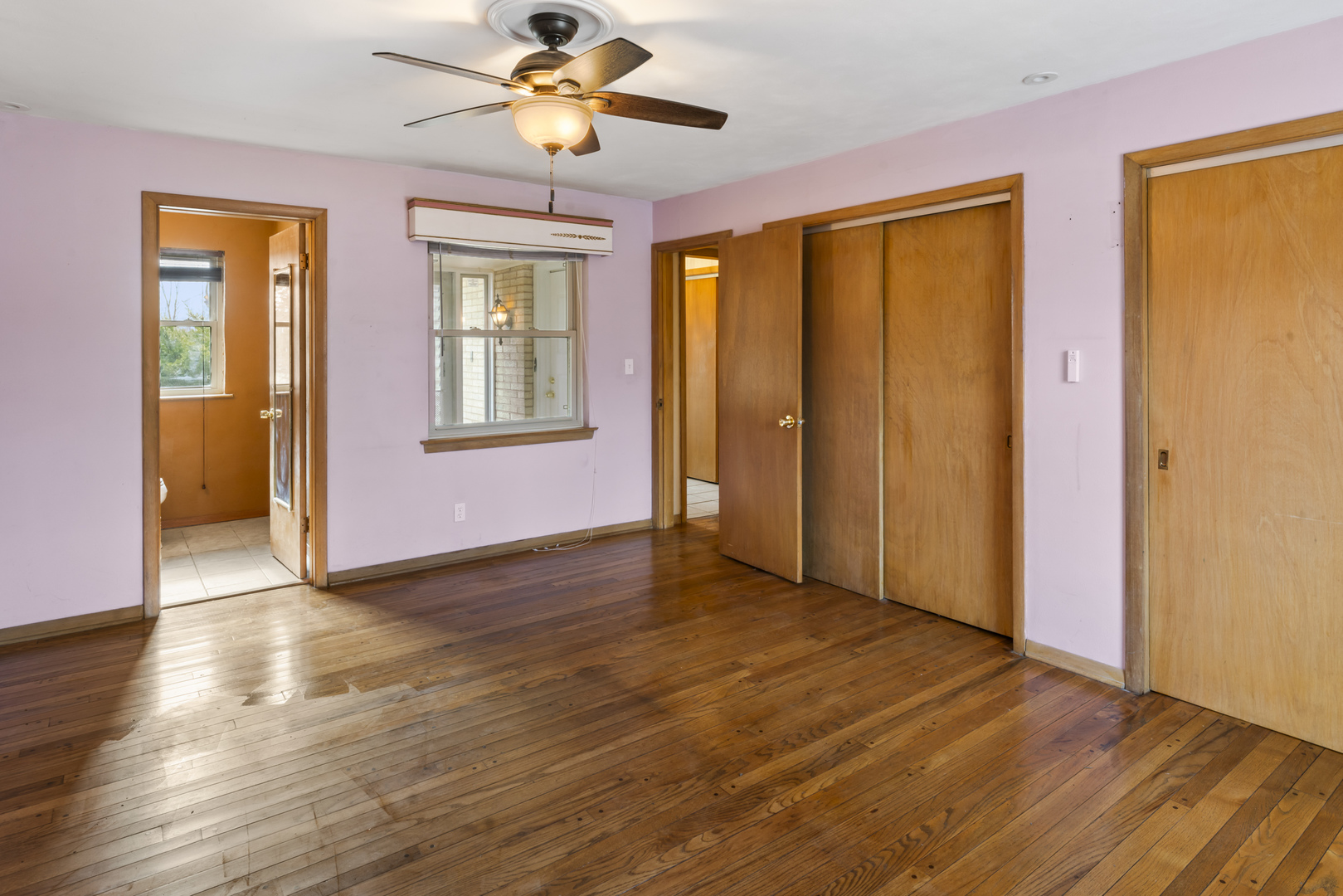 938 Hillcrest Road Elgin, IL 60123 - Photo 11 of 24 a view of an empty room with wooden floor and a window