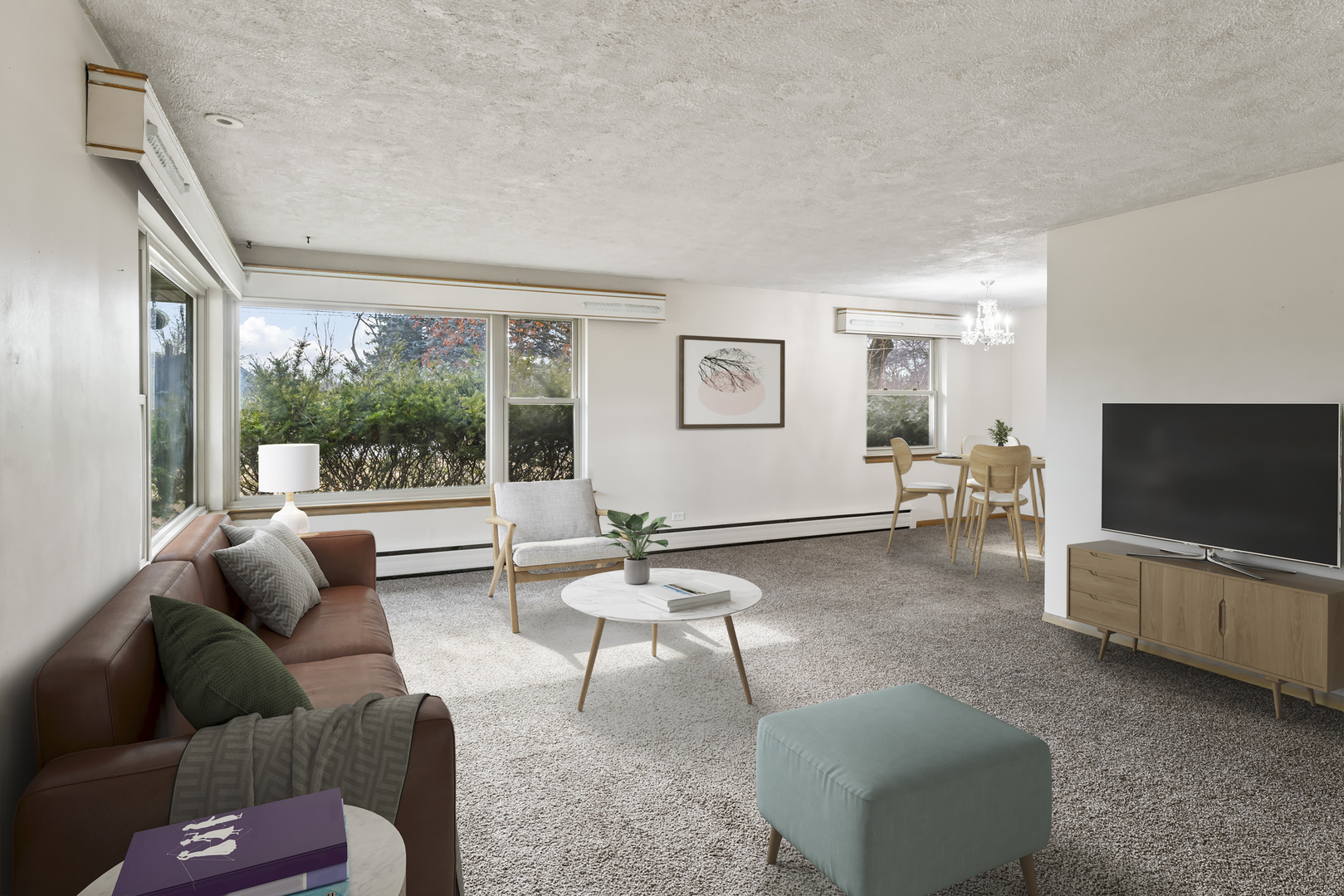 938 Hillcrest Road Elgin, IL 60123 - Photo 3 of 24 a living room with furniture and a flat screen tv