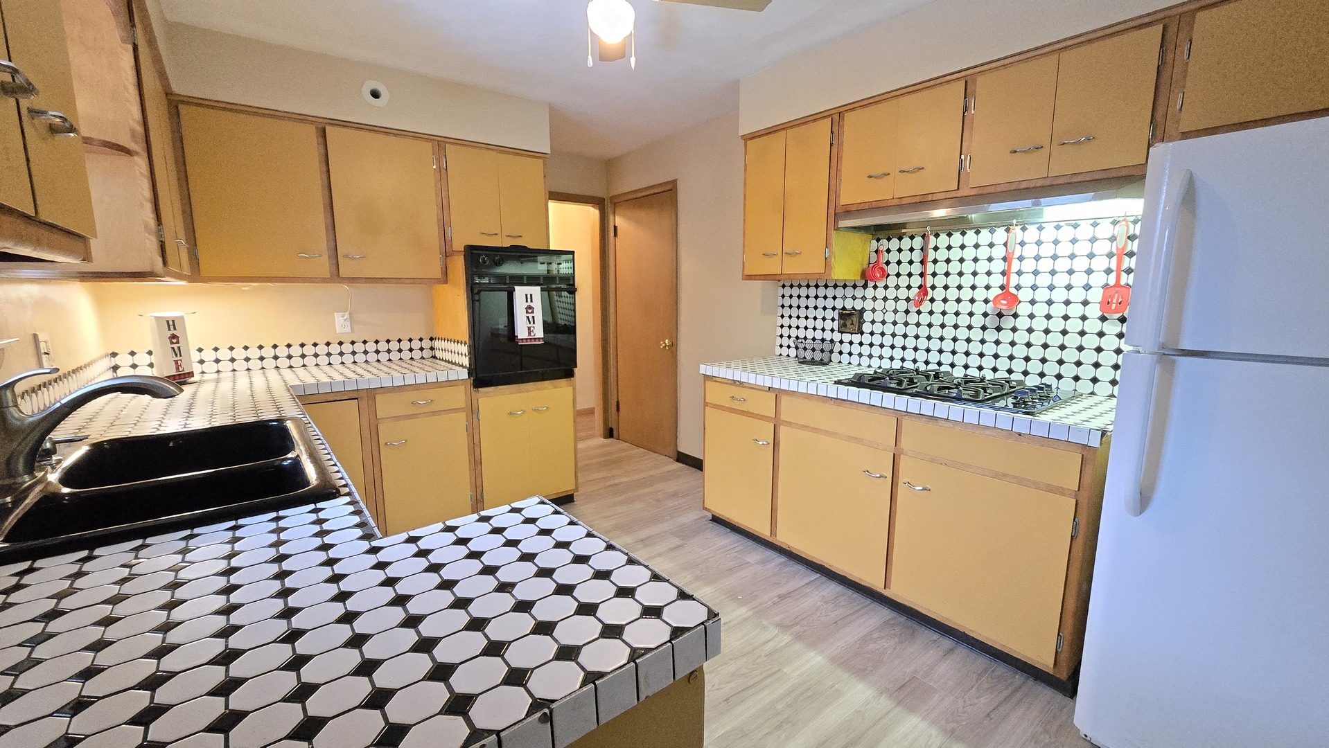 938 Hillcrest Road Elgin, IL 60123 - Photo 8 of 24 a kitchen with a sink and cabinets