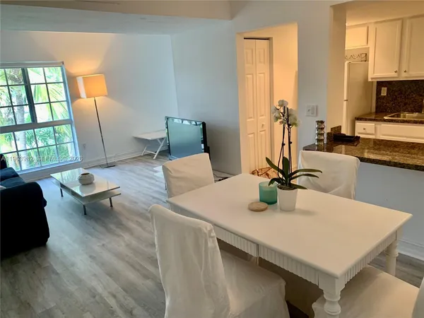 a view of a dining room with furniture window and outside view