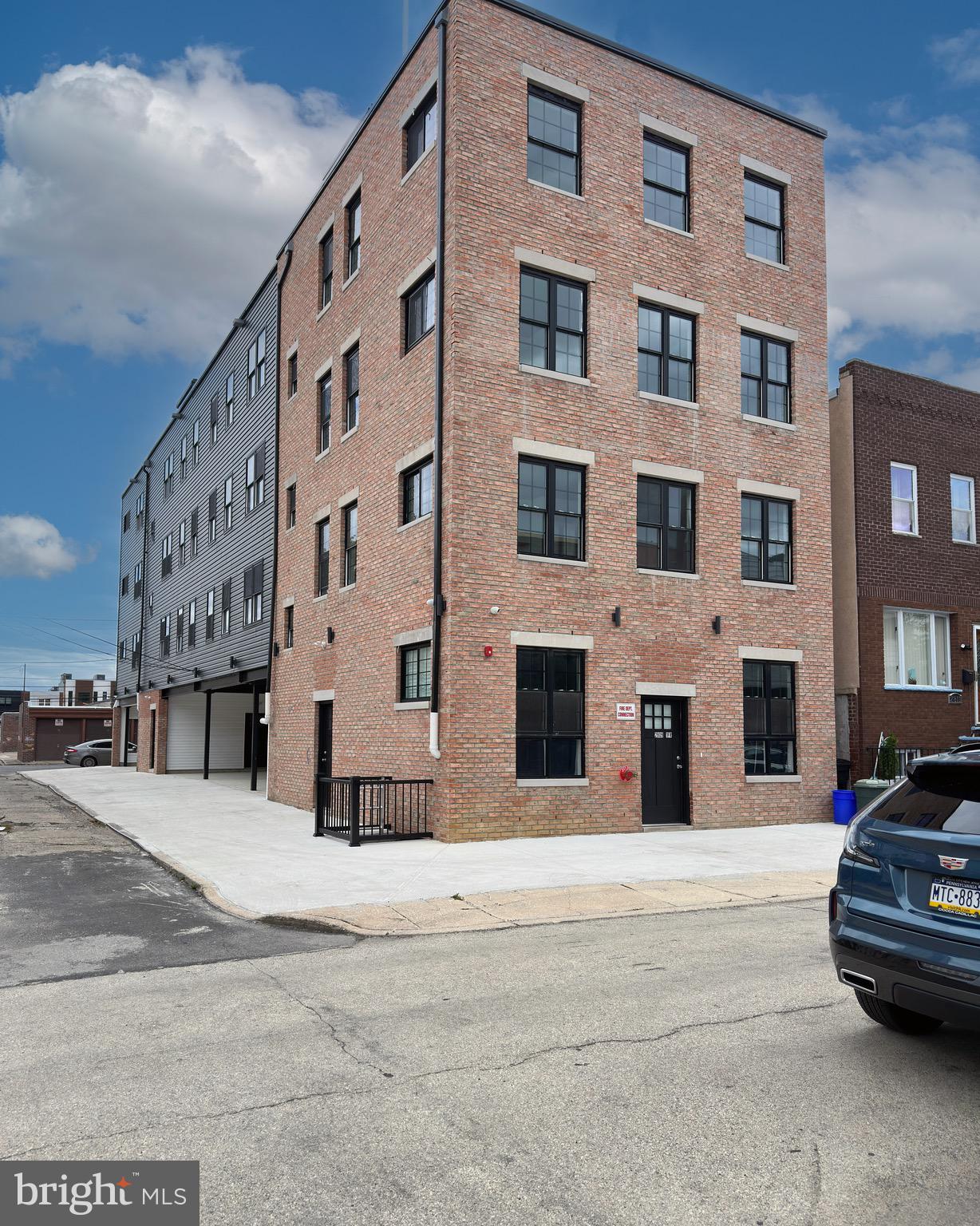 a view of building with parking area