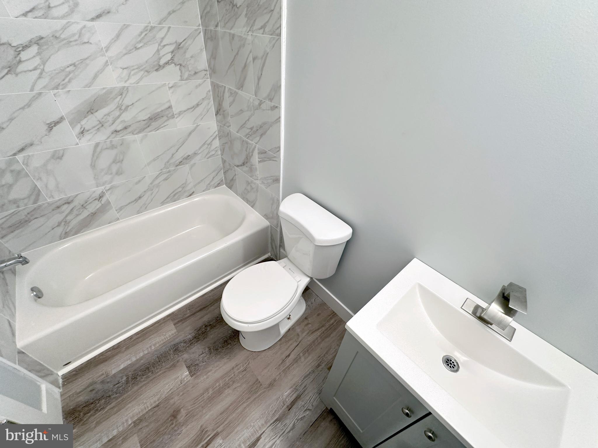 2809 South Warnock Street Philadelphia, PA 19148 - Photo 13 of 17 a bathroom with a sink and a toilet