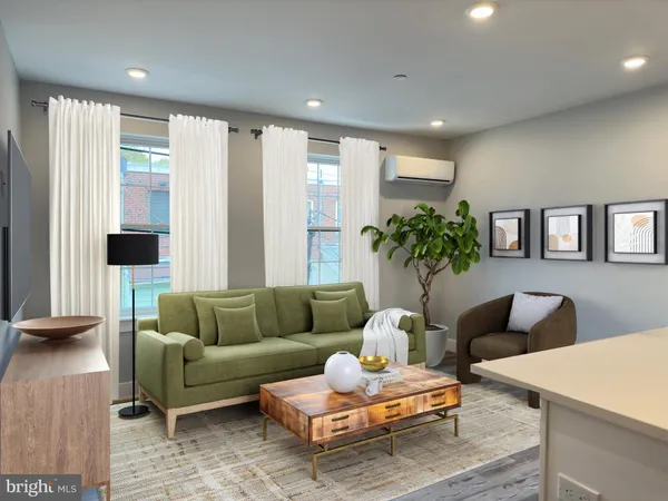 a living room with furniture and a large window