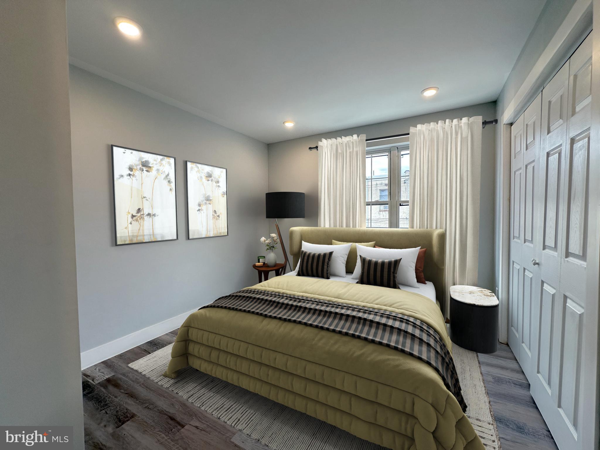 2809 South Warnock Street Philadelphia, PA 19148 - Photo 6 of 17 a bedroom with a bed and a window