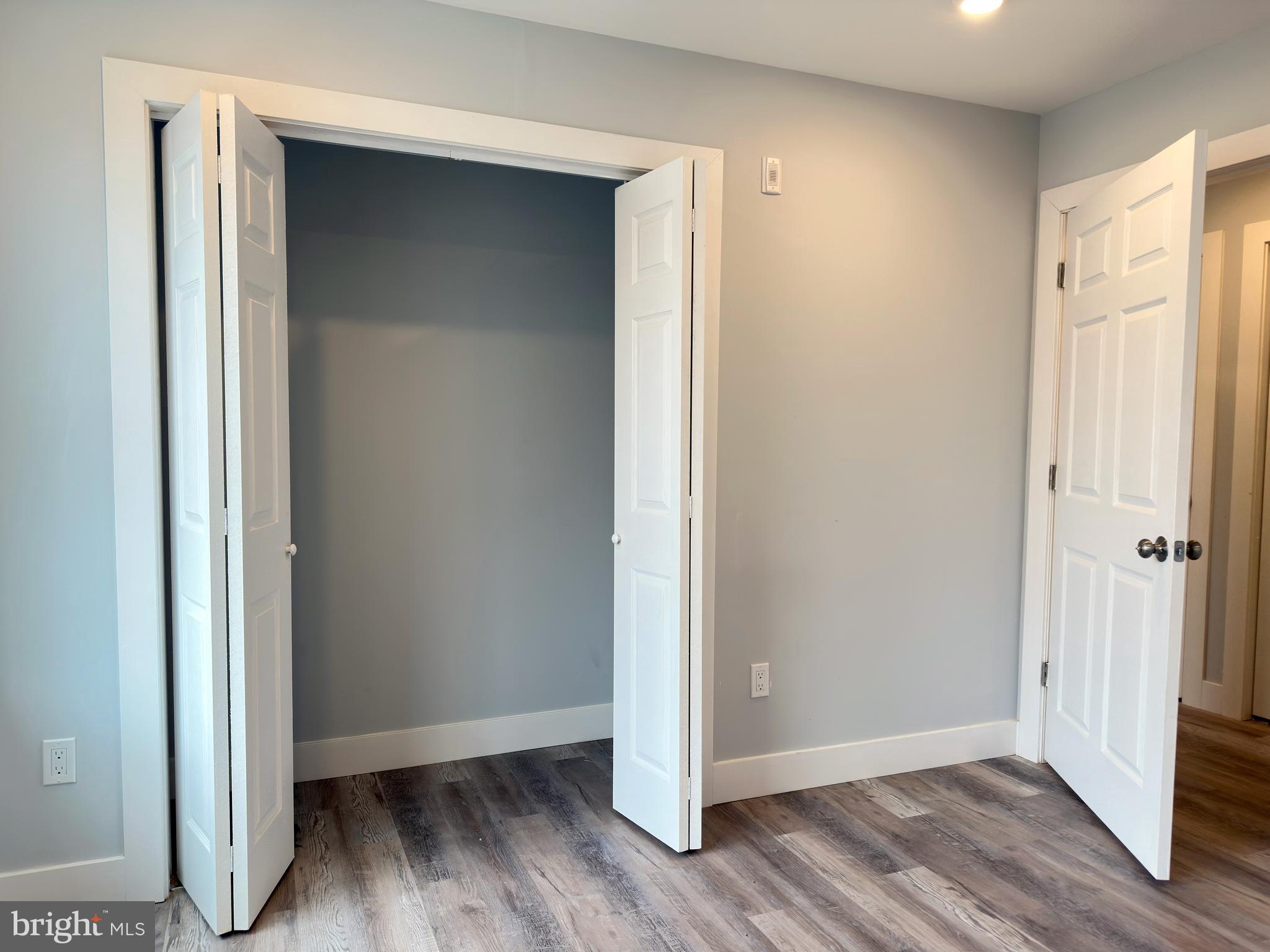 2809 South Warnock Street Philadelphia, PA 19148 - Photo 10 of 17 a view of an empty room with wooden floor and closet