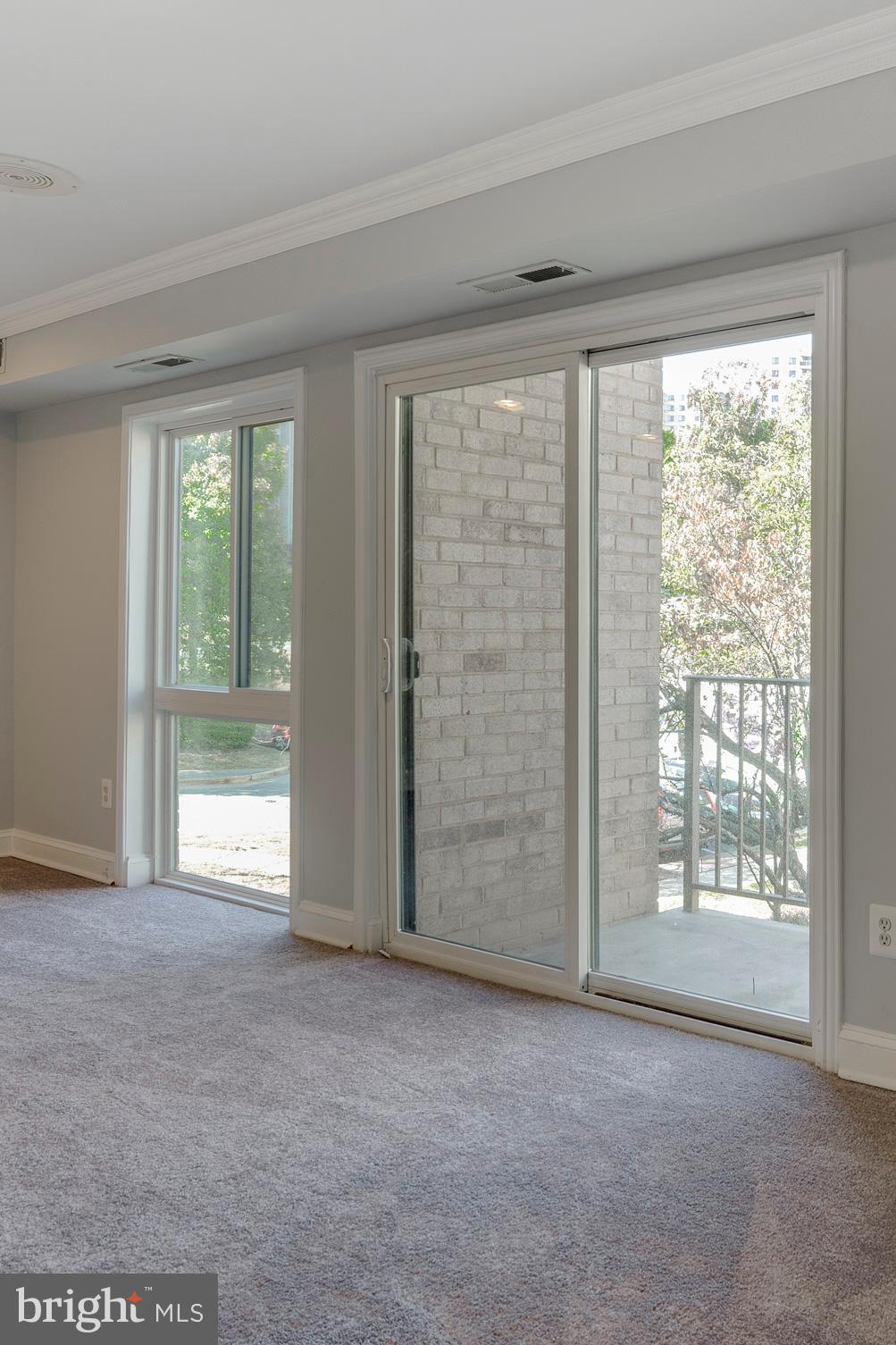 6141 Edsall Road, Unit H Alexandria, VA 22304 - Photo 11 of 29 a view of an empty room with a window