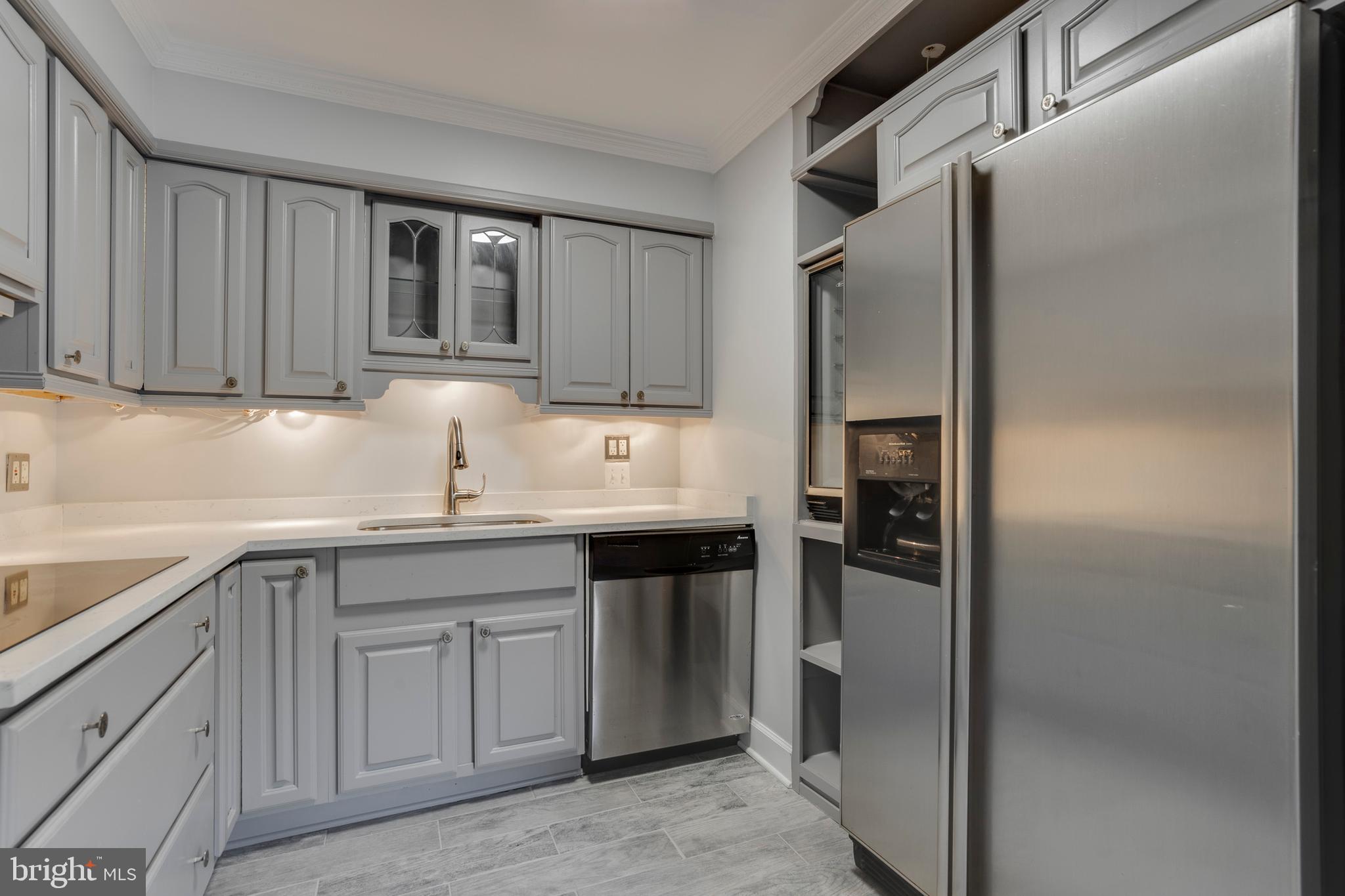6141 Edsall Road, Unit H Alexandria, VA 22304 - Photo 15 of 29 a kitchen with stainless steel appliances granite countertop a refrigerator and a sink