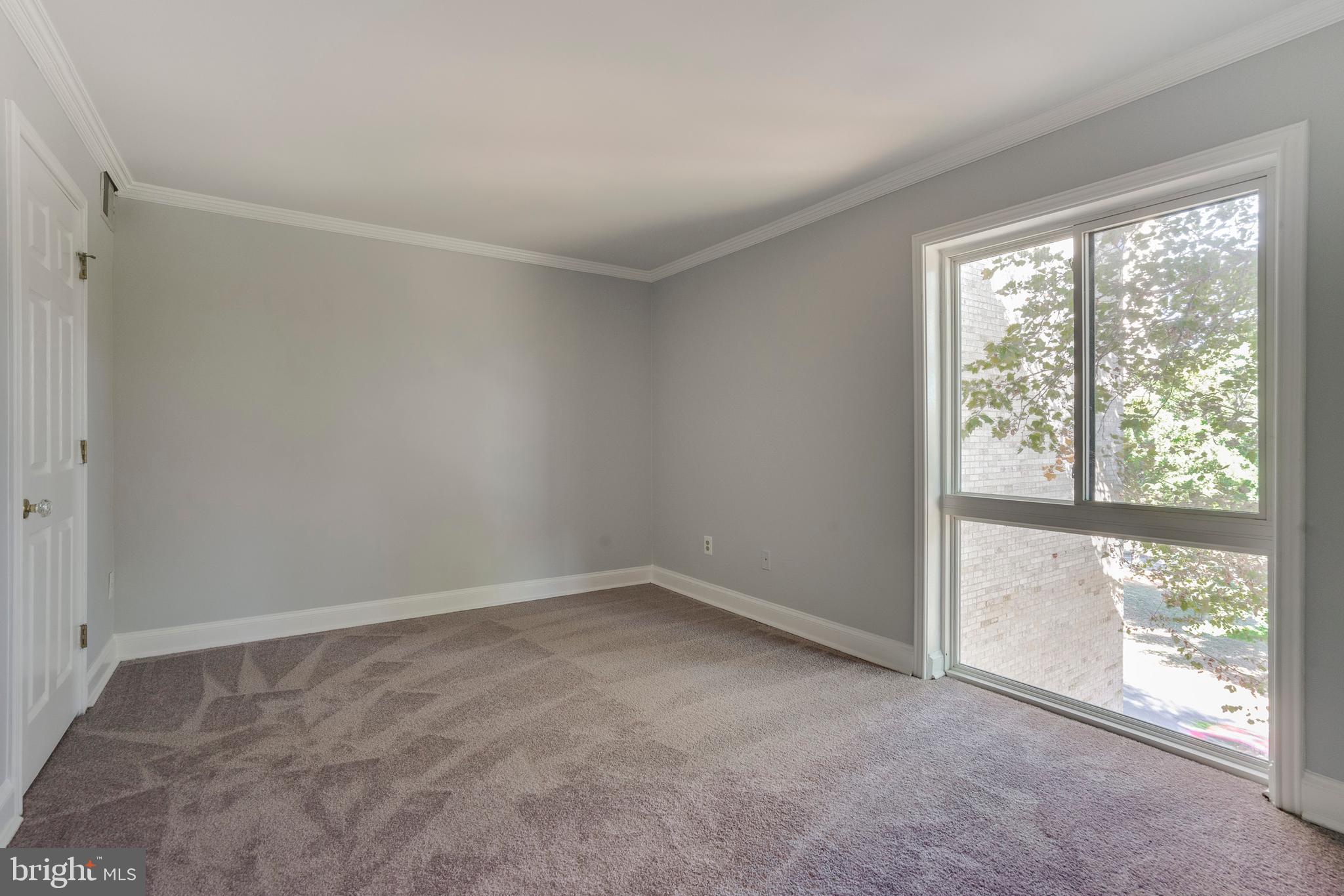 6141 Edsall Road, Unit H Alexandria, VA 22304 - Photo 17 of 29 a view of an empty room with a window