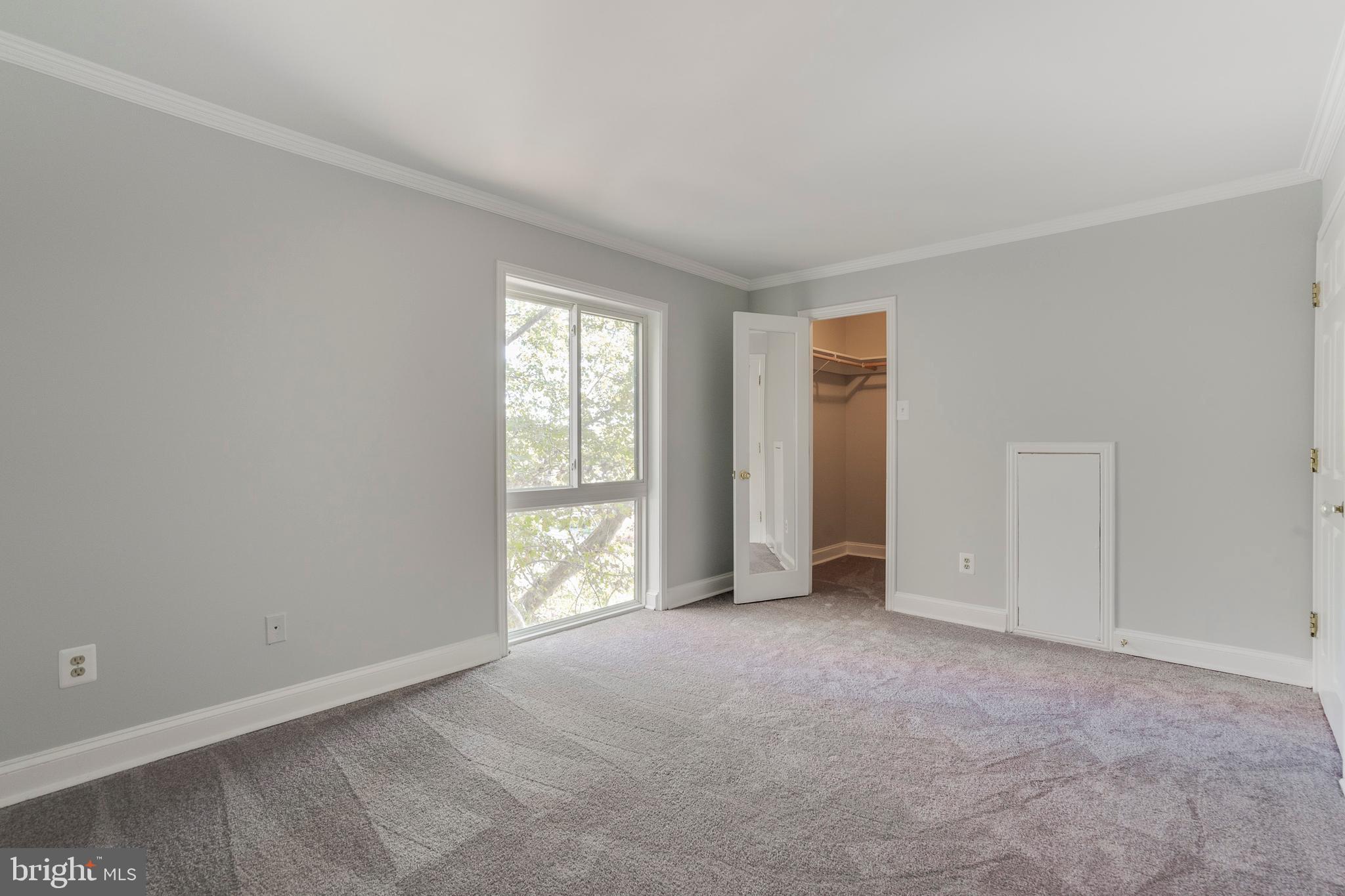6141 Edsall Road, Unit H Alexandria, VA 22304 - Photo 18 of 29 an empty room with windows