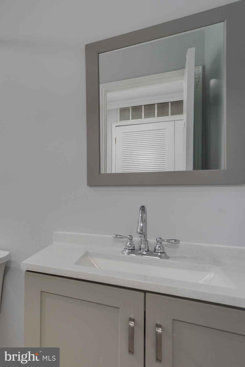 6141 Edsall Road, Unit H Alexandria, VA 22304 - Photo 23 of 29 a bathroom with a sink and a mirror