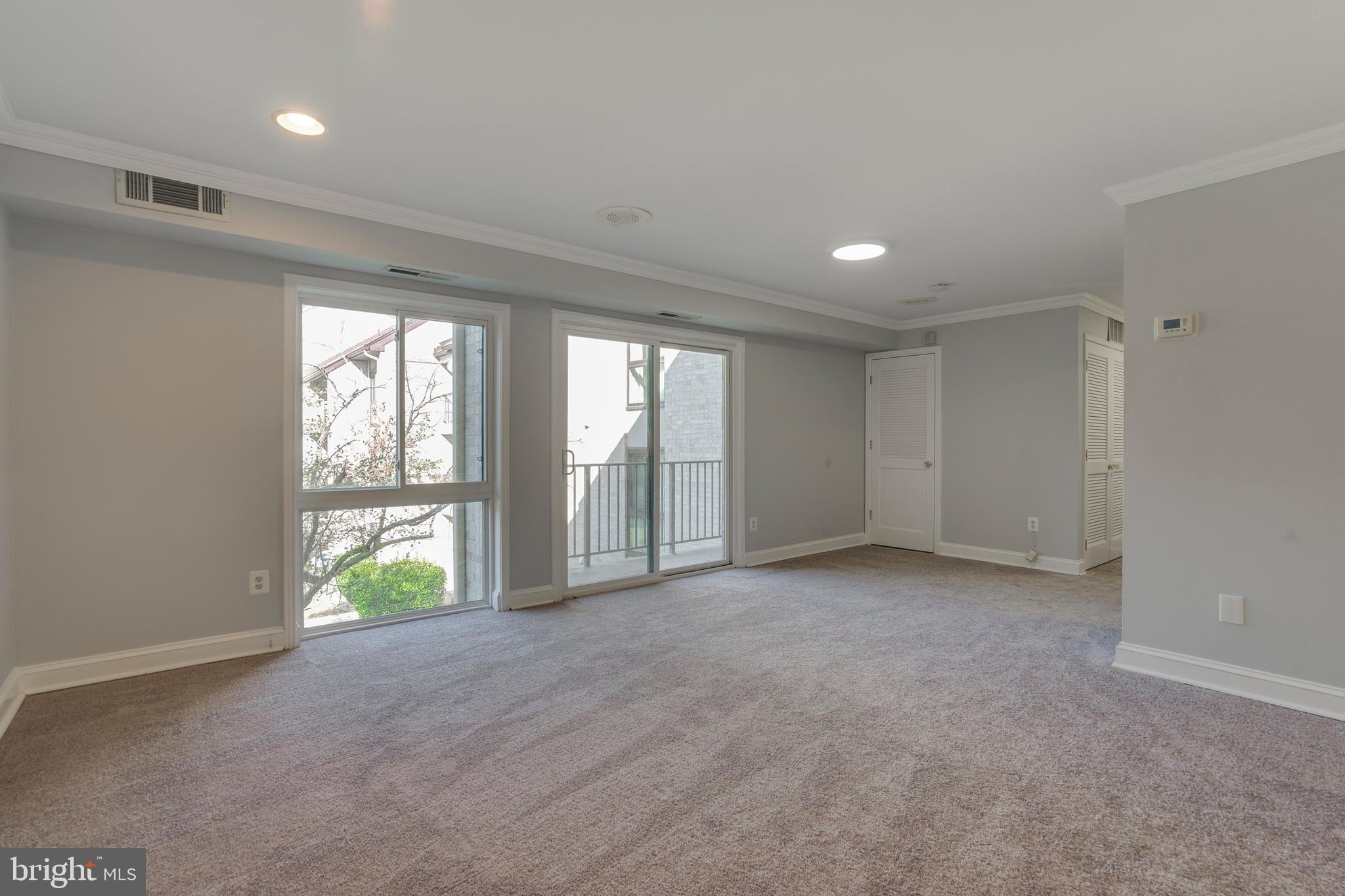 6141 Edsall Road, Unit H Alexandria, VA 22304 - Photo 4 of 29 a view of an empty room with a window