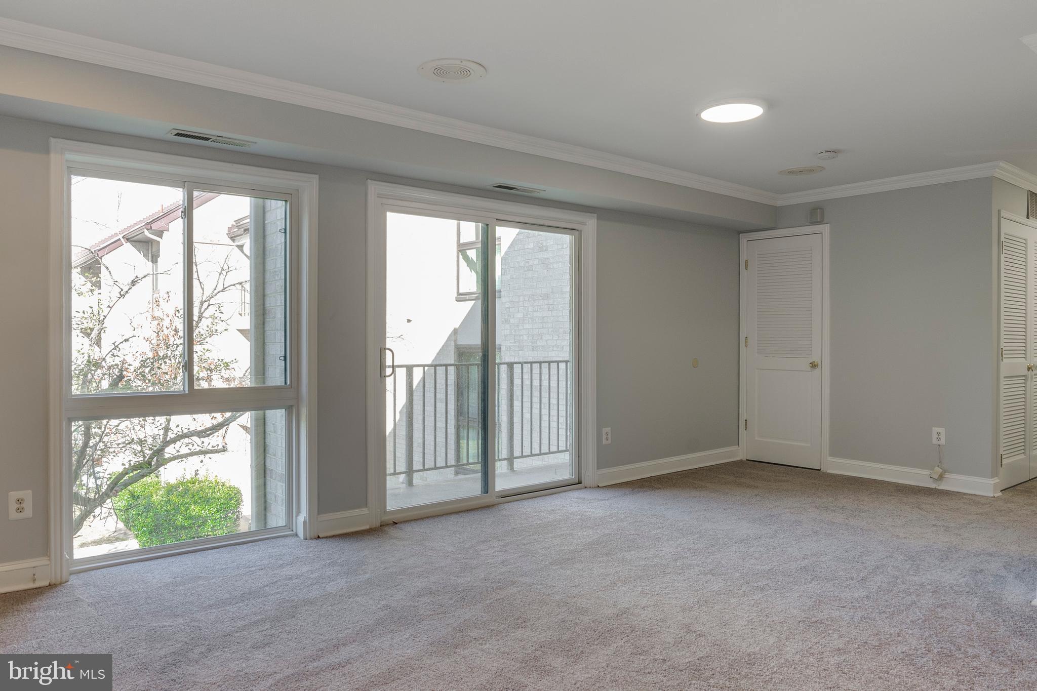 6141 Edsall Road, Unit H Alexandria, VA 22304 - Photo 5 of 29 a view of an empty room with a window