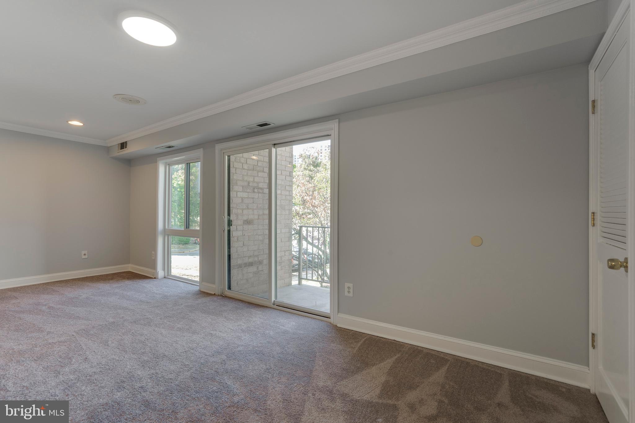 6141 Edsall Road, Unit H Alexandria, VA 22304 - Photo 10 of 29 an empty room with windows
