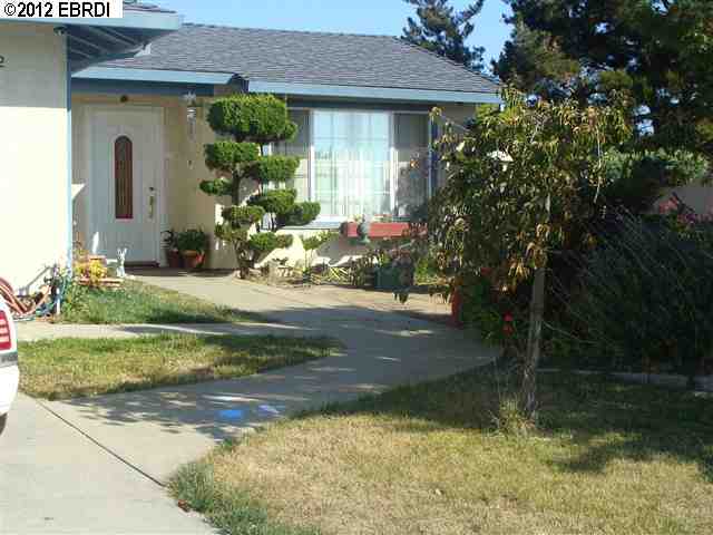 952 Beachpoint Way Rodeo, CA 94572 - Photo 1 of 1 a front view of a house with garden