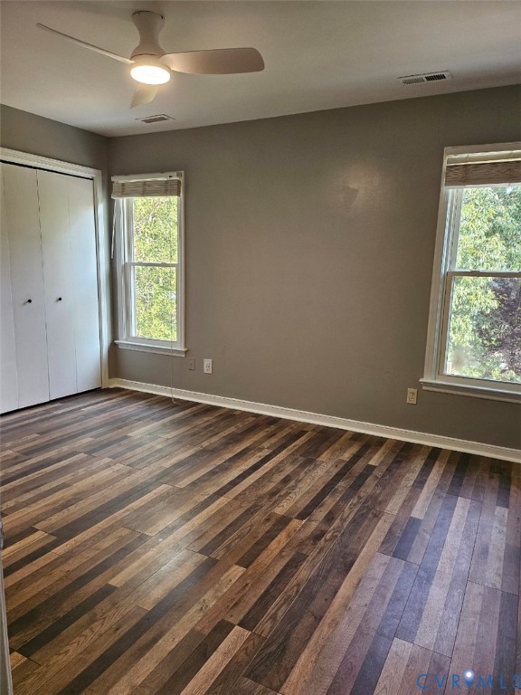 13607 Danwoods Road Midlothian, VA 23113 - Photo 12 of 14 an empty room with wooden floor and windows