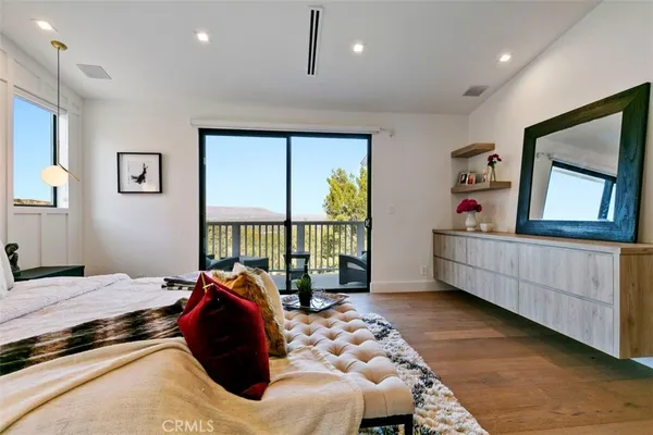 a bed room with a bed and a large window