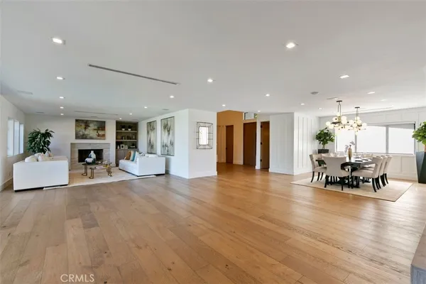 a view of dining room with furniture and wooden floor